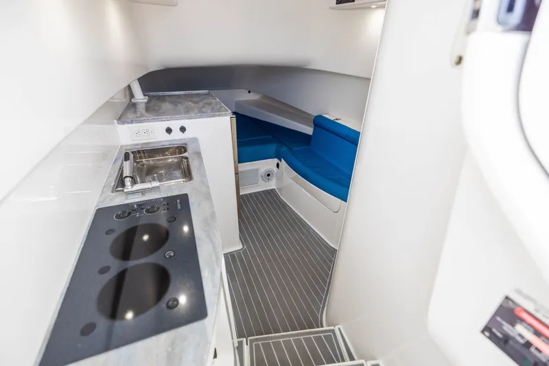 Slide: The Image of Interior of 2020 Contender 44 Fisharound boat with kitchenette and seating area. - 45