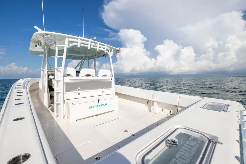 Slide: The Image of 2020 Contender 44 Fisharound boat on open sea under blue sky and clouds. - 34