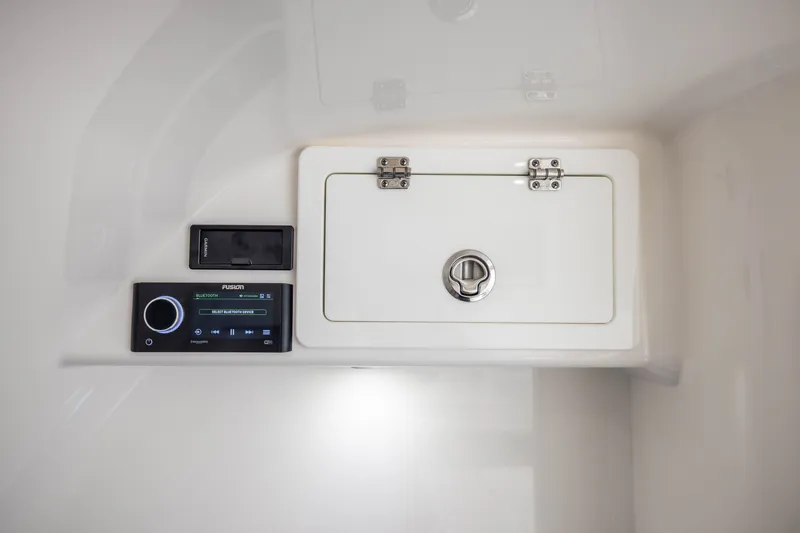 Slide: The Image of 2020 Contender 44 Fisharound control panel with storage compartment and audio system. - 50