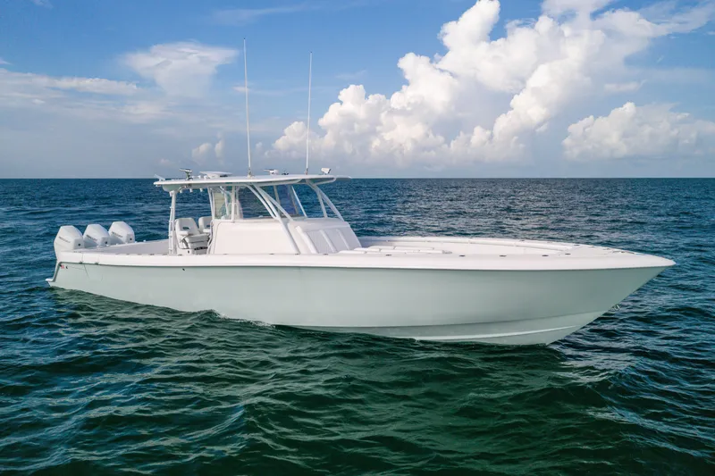 Slide: The Image of 2020 Contender 44 Fisharound boat on open sea under blue sky. - 2