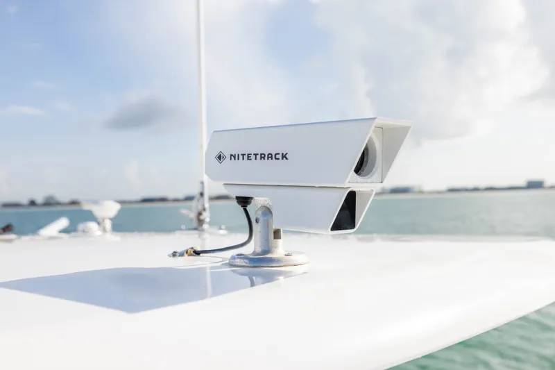 Slide: The Image of NITETRACK camera on 2020 Contender 44 Fisharound boat, overlooking calm sea and cloudy sky. - 20