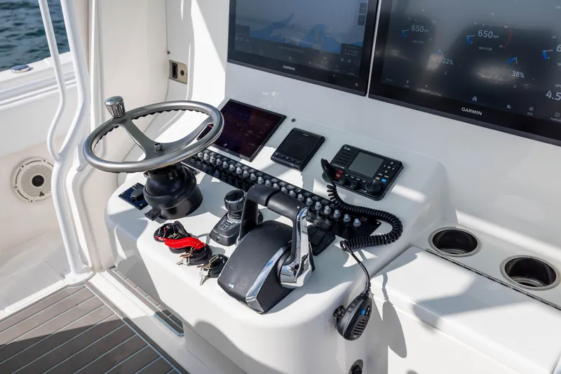 Slide: The Image of Helm of 2020 Contender 44 Fisharound with advanced navigation equipment and controls. - 30