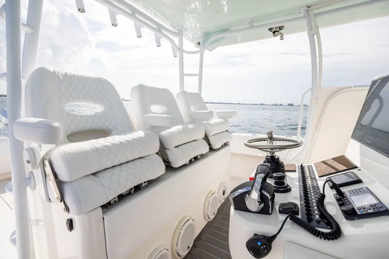 Slide: The Image of 2020 Contender 44 Fisharound boat interior with luxurious seating and modern controls. - 24