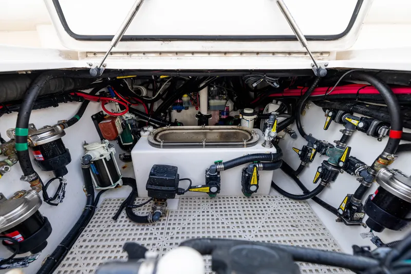 Slide: The Image of Engine compartment of 2020 Contender 44 Fisharound boat, showcasing complex mechanical systems. - 43