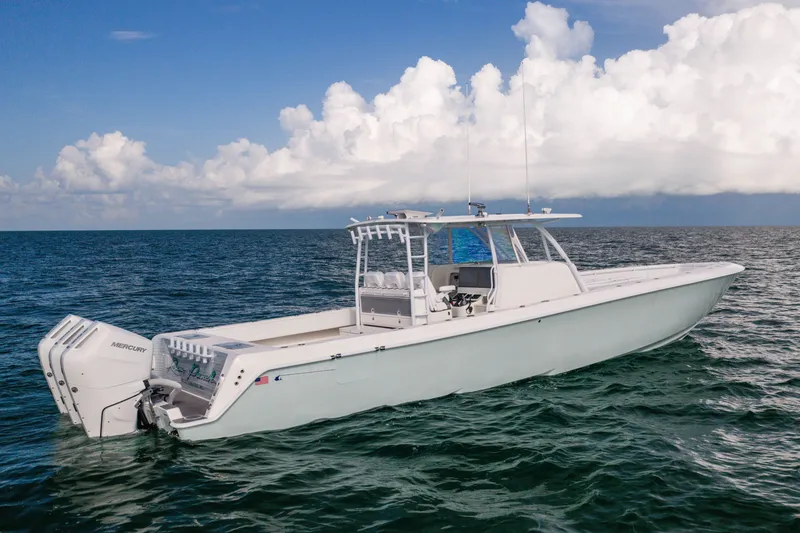Slide: The Image of 2020 Contender 44 Fisharound boat on open sea under cloudy sky. - 3