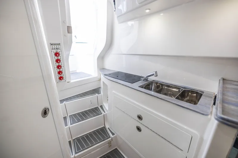 Slide: The Image of Interior of 2020 Contender 44 Fisharound boat with sink and stairs. - 49