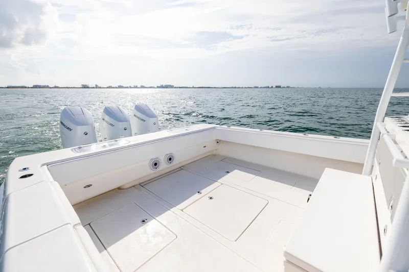 Slide: The Image of 2020 Contender 44 Fisharound boat with triple Mercury engines on open water. - 37