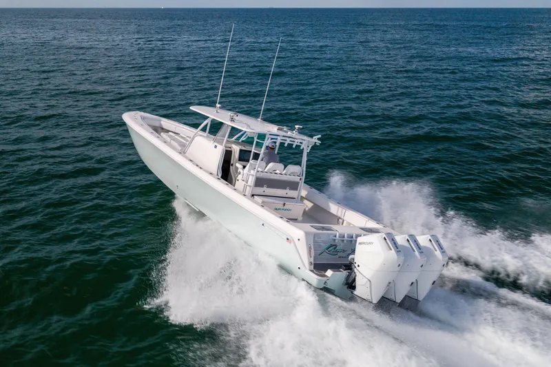 Slide: The Image of 2020 Contender 44 Fisharound boat cruising on open ocean waters. - 7