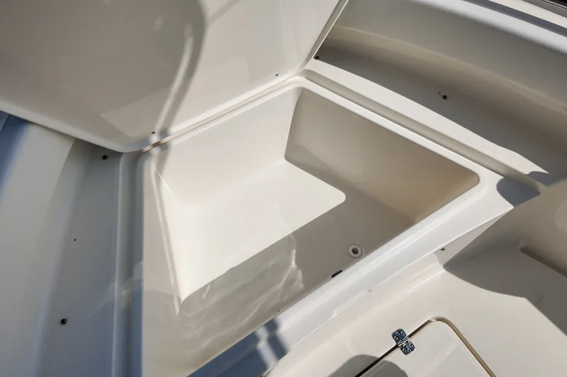 Slide: The Image of Open storage compartment on 2027 Bulls Bay 200 Center Console boat. - 12