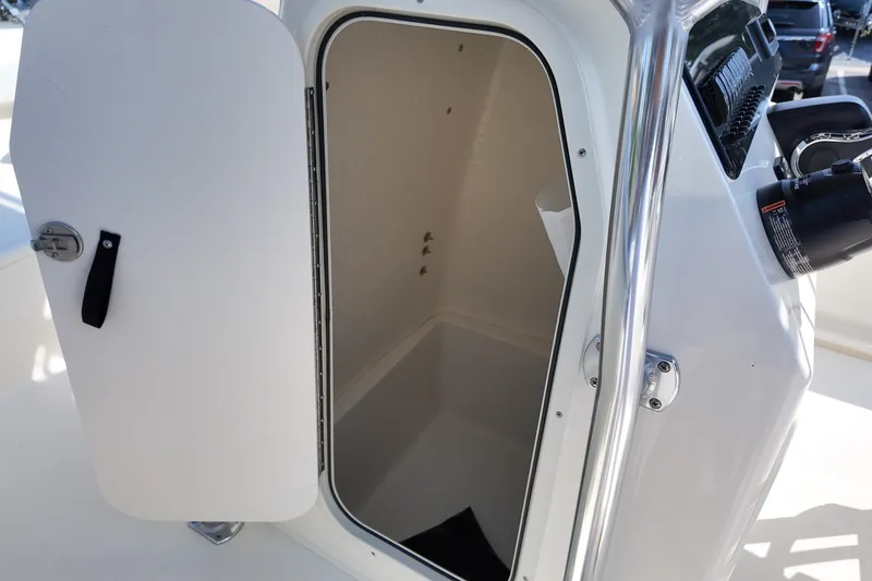 Slide: The Image of Open storage compartment on a 2027 Bulls Bay 200 Center Console boat. - 13