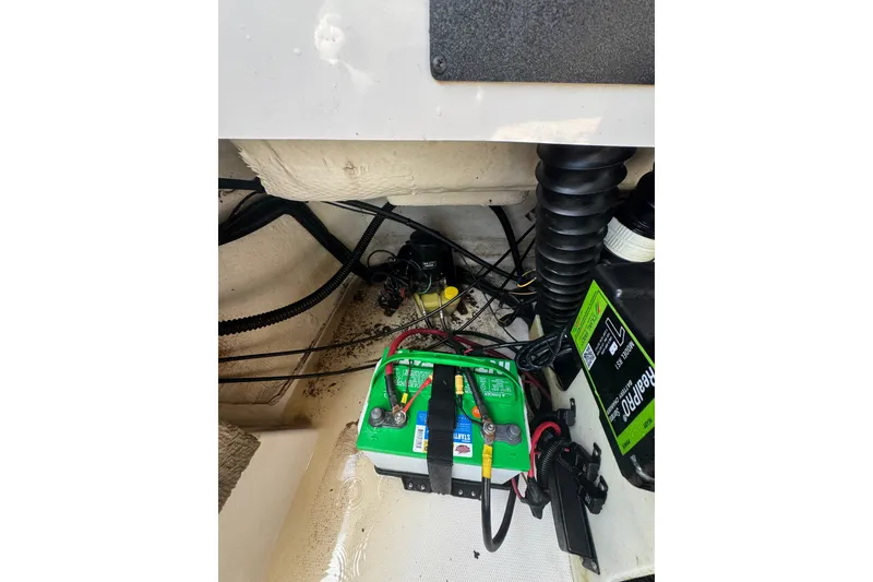 Slide: The Image of Battery compartment of a 2000 Chaparral 216 SSi boat with wiring and components. - 20
