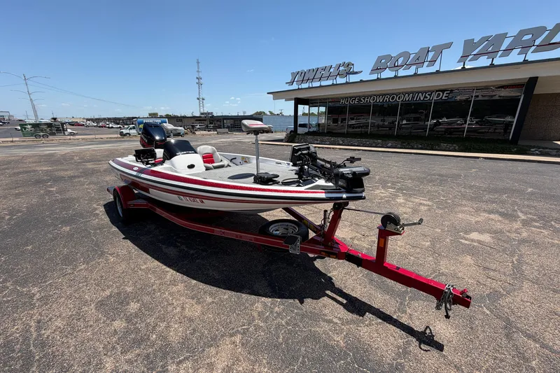 Slide: The Image of 2008 Skeeter SX190 boat on trailer outside a boat showroom. - 2