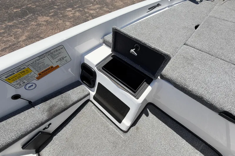 Slide: The Image of 2008 Skeeter SX190 boat interior with storage compartment and capacity label. - 26