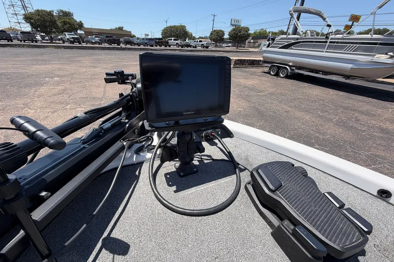 Slide: The Image of 2008 Skeeter SX190 boat with Garmin fishfinder and trolling motor in parking lot. - 14