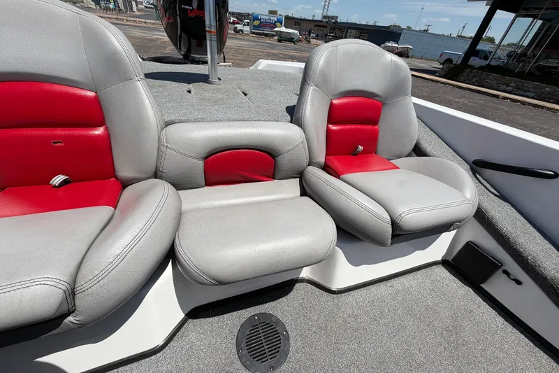 Slide: The Image of 2008 Skeeter SX190 boat interior with gray and red seating, showcasing comfortable design. - 30