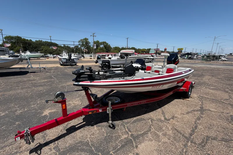 Slide: The Image of 2008 Skeeter SX190 boat on red trailer in outdoor dealership lot. - 4