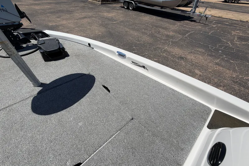 Slide: The Image of 2008 Skeeter SX190 boat deck with trolling motor, parked on asphalt. - 22