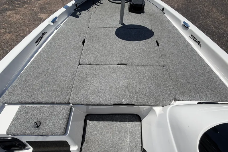 Slide: The Image of 2008 Skeeter SX190 boat deck with gray carpet and storage compartments. - 20