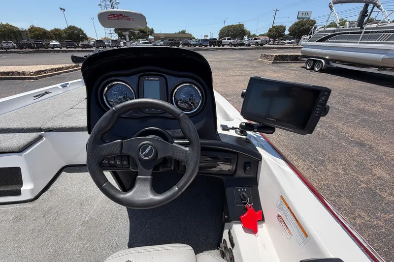 Slide: The Image of 2008 Skeeter SX190 boat dashboard with steering wheel and navigation display. - 36