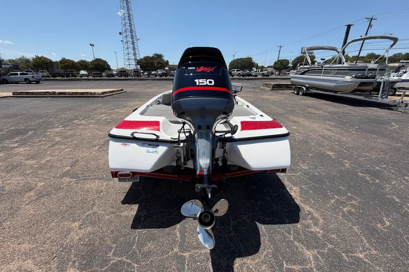 Slide: The Image of 2008 Skeeter SX190 boat with Yamaha 150 engine, parked outdoors. - 8