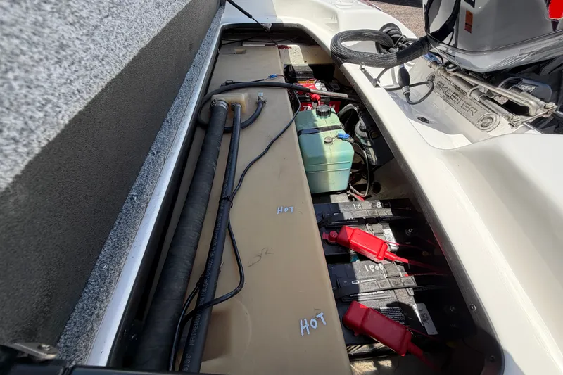 Slide: The Image of 2008 Skeeter SX190 boat battery compartment with wiring and components visible. - 48
