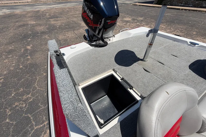 Slide: The Image of 2008 Skeeter SX190 boat interior with Yamaha engine, open storage compartment, and seating. - 46