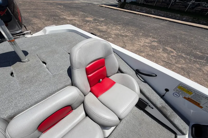 Slide: The Image of 2008 Skeeter SX190 boat interior with gray and red seating. - 28