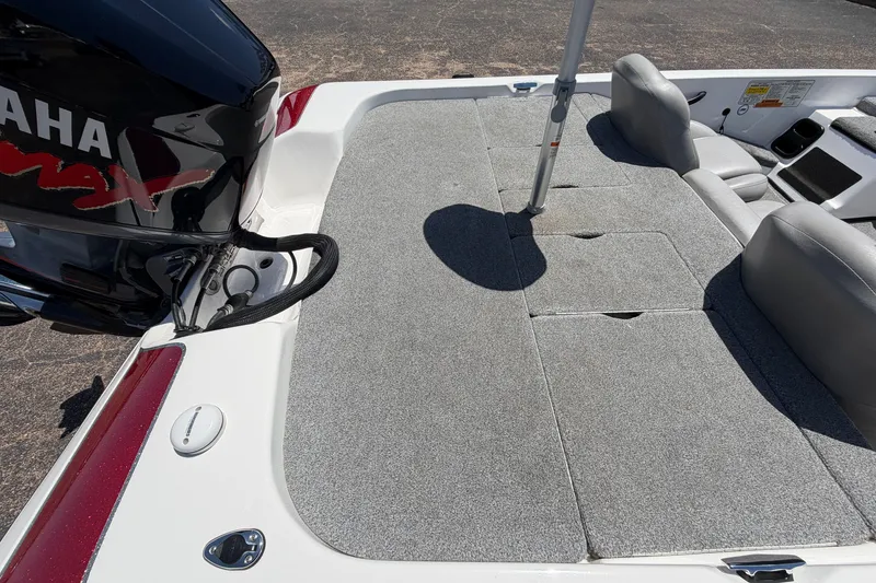 Slide: The Image of 2008 Skeeter SX190 boat interior with Yamaha engine, featuring gray carpeted deck and seating. - 44