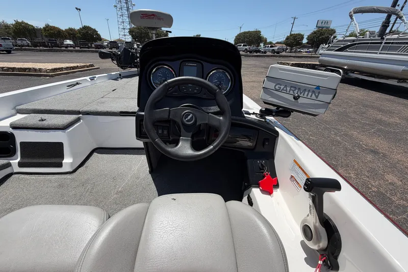 Slide: The Image of 2008 Skeeter SX190 boat cockpit with steering wheel and Garmin navigation system. - 35