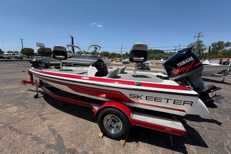 Slide: The Image of 2008 Skeeter SX190 boat with Yamaha VMAX engine, parked outdoors on a sunny day. - 6