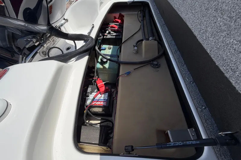 Slide: The Image of 2008 Skeeter SX190 boat battery compartment with wiring and components. - 47
