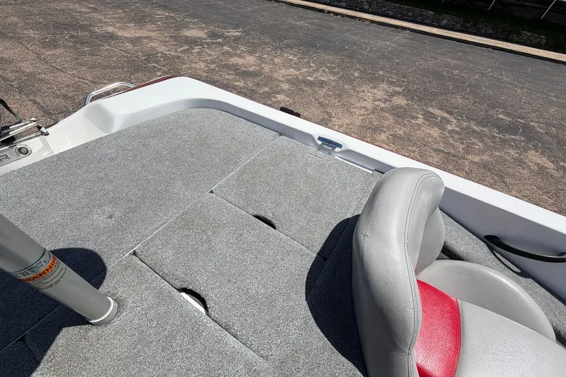 Slide: The Image of 2008 Skeeter SX190 boat interior with gray carpet and seating. - 38