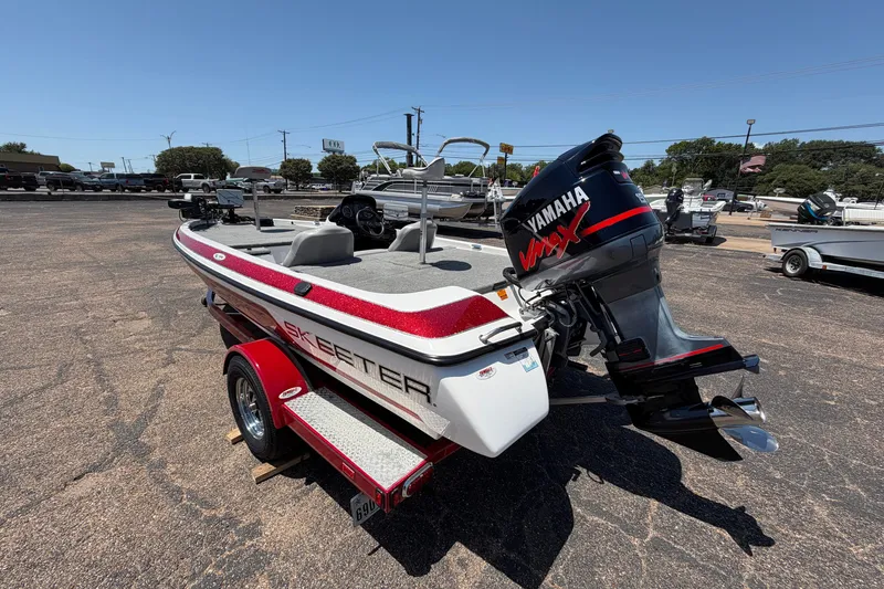 Slide: The Image of 2008 Skeeter SX190 boat with Yamaha VMAX engine on trailer in parking lot. - 7
