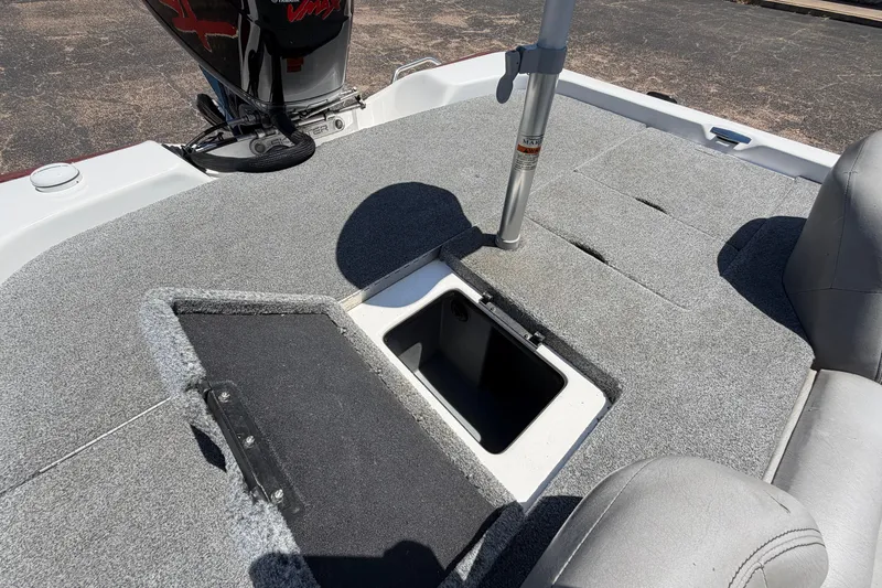 Slide: The Image of 2008 Skeeter SX190 boat interior with open storage compartment and motor view. - 43