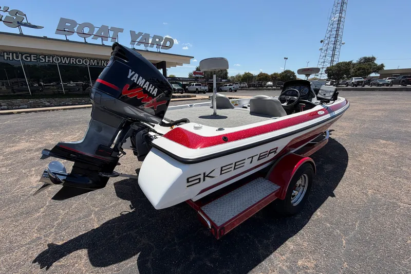 Slide: The Image of 2008 Skeeter SX190 boat with Yamaha engine at a boat yard. - 9