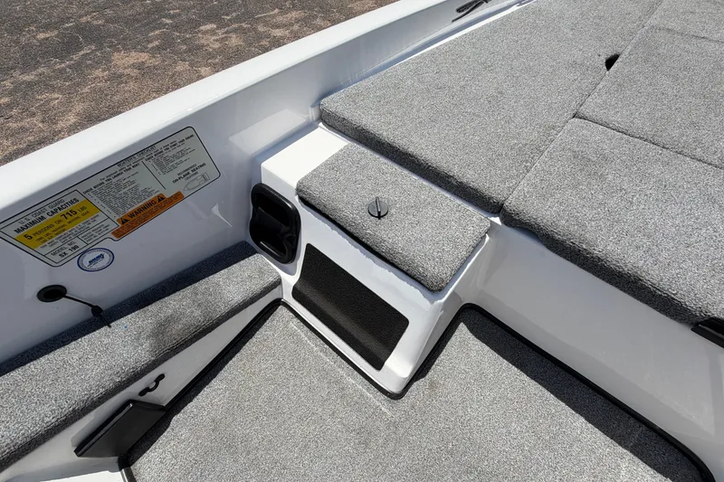 Slide: The Image of 2008 Skeeter SX190 boat interior with gray carpet and seating area. - 25