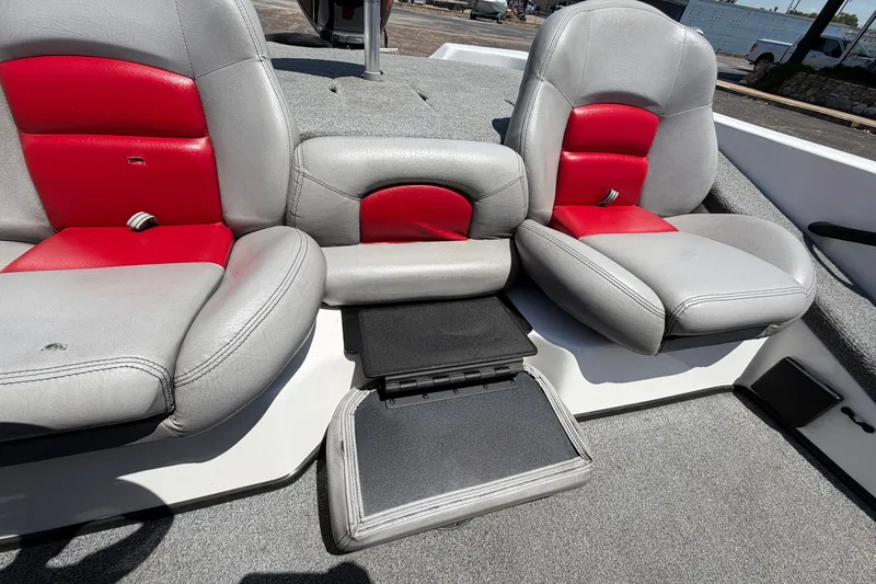 Slide: The Image of 2008 Skeeter SX190 boat interior with gray and red seating and storage compartment. - 31