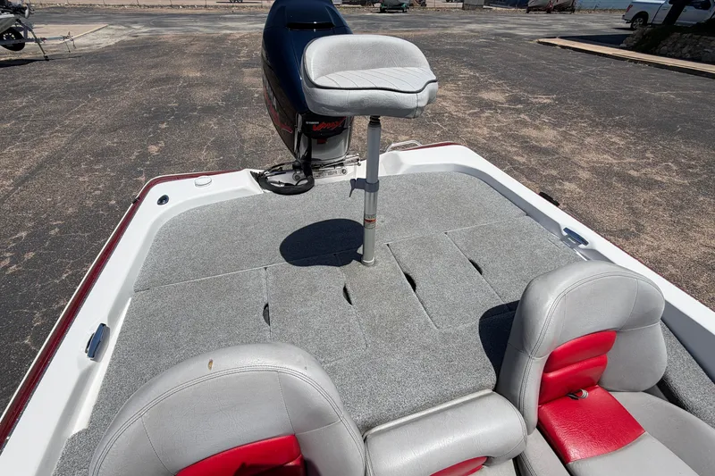 Slide: The Image of 2008 Skeeter SX190 boat interior with gray and red seating, featuring a raised fishing seat. - 37