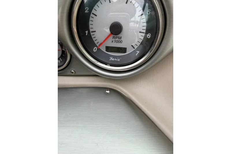Slide: The Image of Close-up of 2011 Hurricane SunDeck 237 OB tachometer showing RPM gauge. - 7