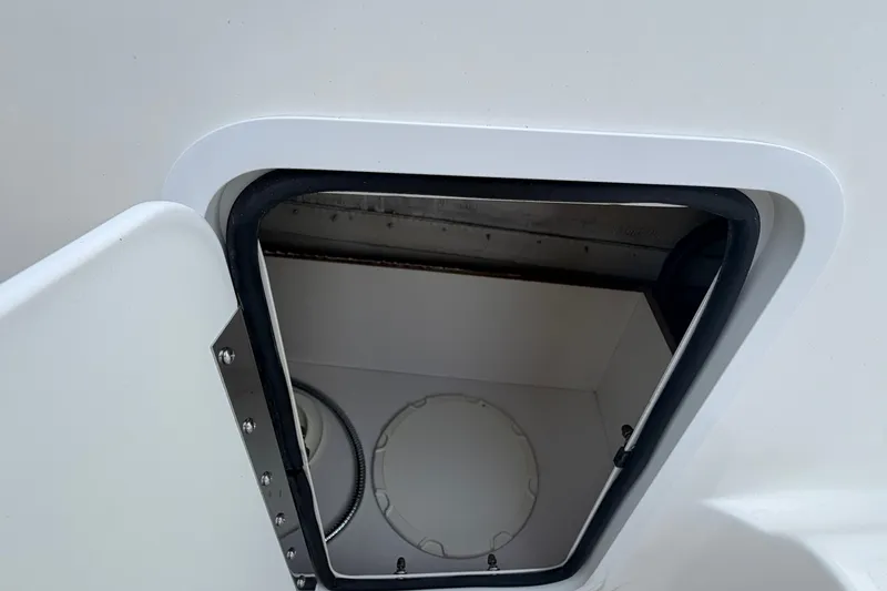 Slide: The Image of Open storage compartment on a 2011 Hurricane SunDeck 237 OB boat. - 9