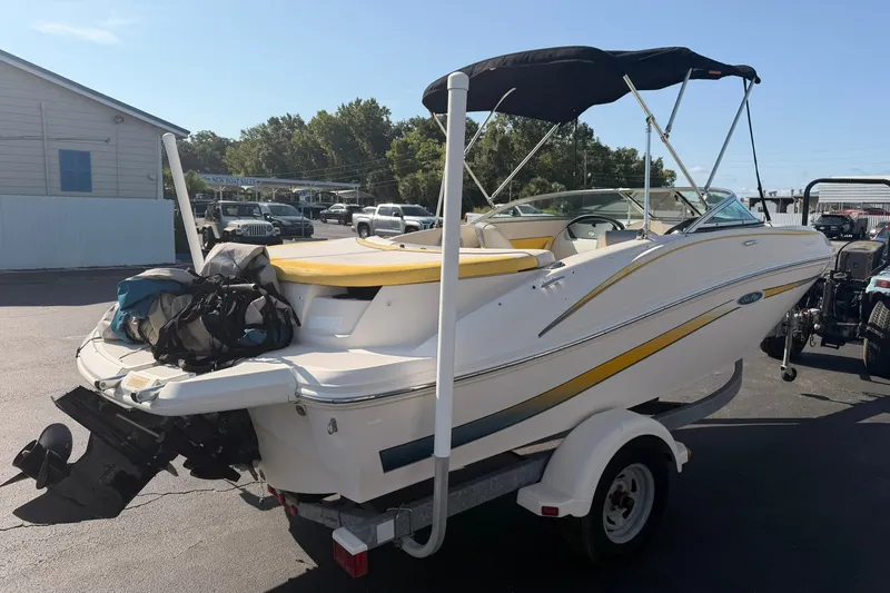 Slide: The Image of 2006 Sea Ray 185 Sport boat on trailer with canopy and gear bags. - 3