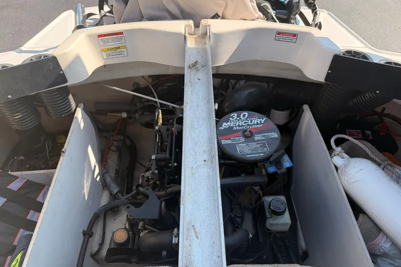 Slide: The Image of Engine compartment of a 2006 Sea Ray 185 Sport with Mercury MerCruiser 3.0 engine. - 12