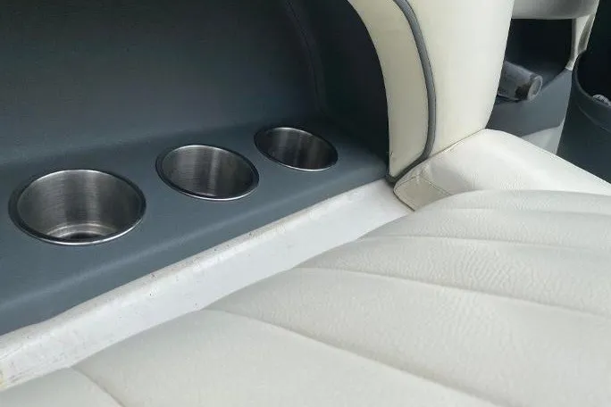 Slide: The Image of Interior of 2007 Cobalt 240 boat with cup holders and white seating. - 14