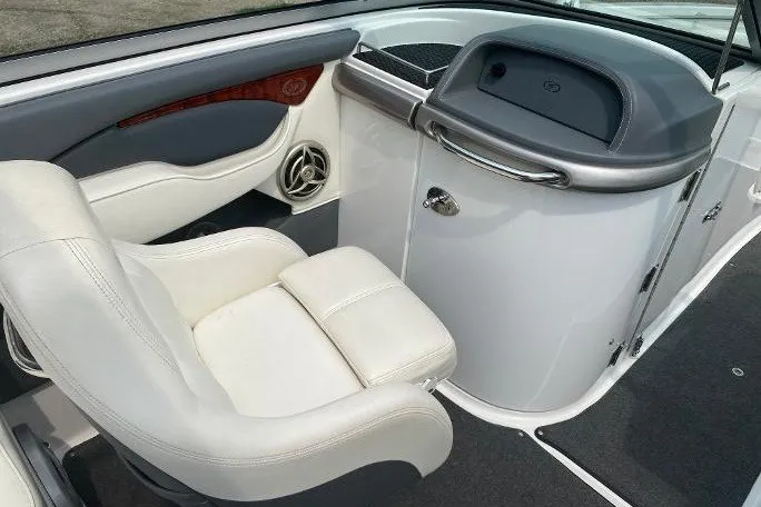 Slide: The Image of 2007 Cobalt 240 boat interior with white seating and sleek dashboard design. - 7