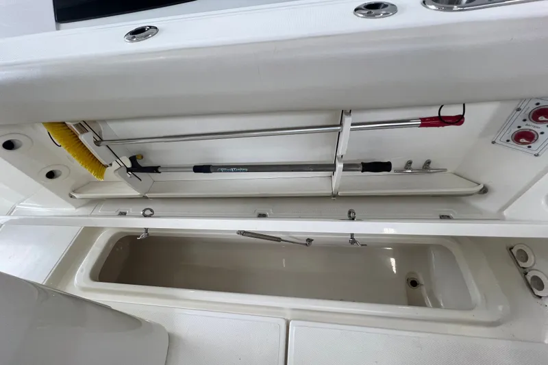 Slide: The Image of Storage compartment of 2019 Boston Whaler 280 Outrage boat, featuring organized equipment. - 24