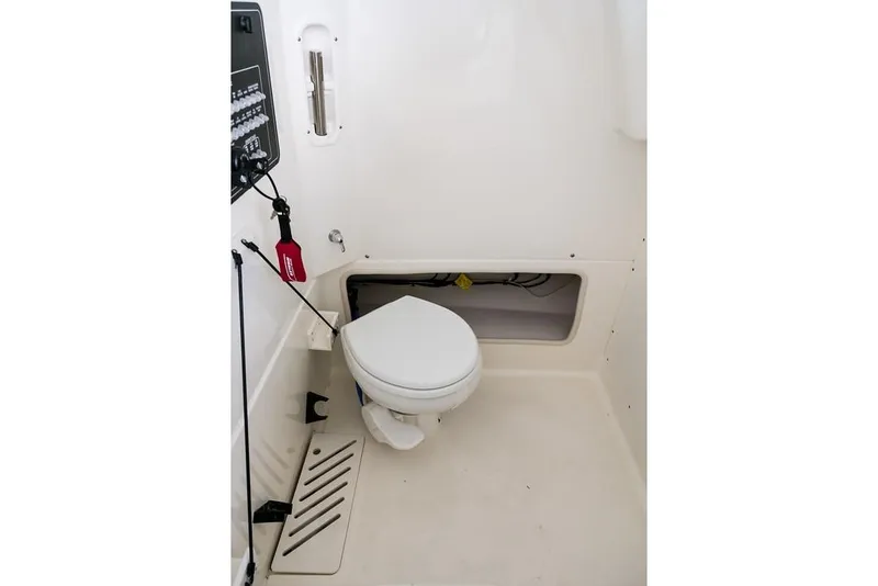 Slide: The Image of Manufacturer Provided Image: 2019 Boston Whaler 280 Outrage boat interior with toilet. - 26