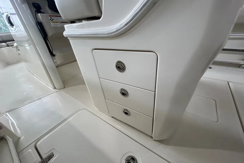 Slide: The Image of Interior storage drawers on a 2019 Boston Whaler 280 Outrage boat. - 23