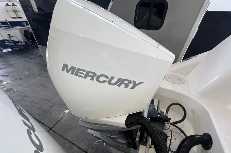Slide: The Image of Mercury outboard engine on a 2019 Boston Whaler 280 Outrage boat in a garage. - 3