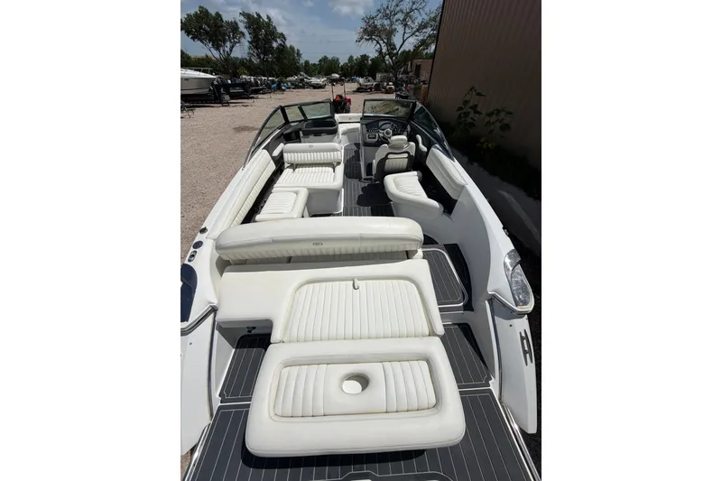 Slide: The Image of 2013 Cobalt R5 boat with spacious white seating and sleek design. - 10