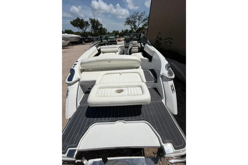 Slide: The Image of 2013 Cobalt R5 boat with white seating and sleek design under a blue sky. - 14